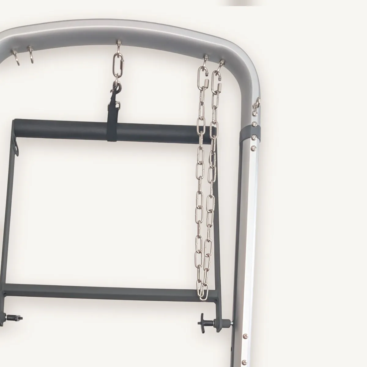The tower’s chains against a white wall.